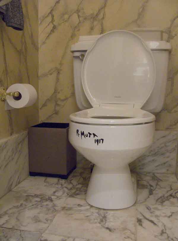 The Levines have stenciled the toilets in their house with Duchamp's pseudonymous "R. Mutt" signature from his notorious urinal. 
